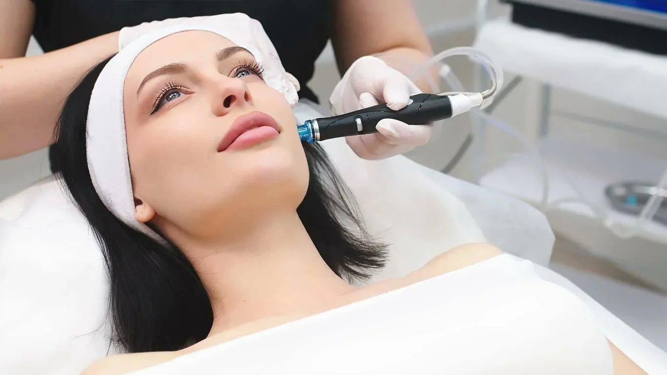 Esthetician giving a hydrating facial treatment